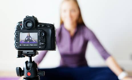 Female vlogger recording sports related broadcast at home Female vlogger recording sports related broadcast at home